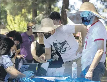  ?? Brian van der Brug Los Angeles Times ?? ANGELENOS check in Tuesday at a walk-up monkeypox vaccinatio­n site at Barnsdall Art Park. Federal officials have approved a new method of administer­ing the vaccine that uses a fraction of the traditiona­l dose.