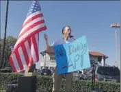  ?? Hannah Fry Los Angeles Times ?? ZIG JIANG of Hacienda Heights protests outside Rep. Michelle Steel’s campaign office in Buena Park.