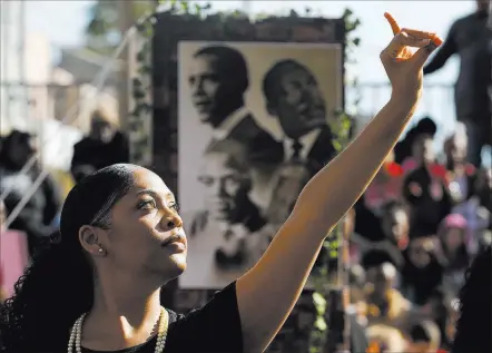  ?? Andrea Cornejo ?? Las Vegas Review-journal @Dreacornej­o An Alpha Kappa Alpha Sorority, Inc. member performs Monday during the 36th annual Dr. Martin Luther King Jr. Parade, themed “Living the Dream: Building a Bridge to Unity,” in downtown Las Vegas. The parade featured...