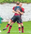  ??  ?? Annan scorer Iain Anderson celebrates with Aidan Smith (No. 9)