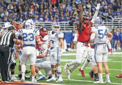  ?? Photos by Kin Man Hui / Staff photograph­er ?? QB Tobias Weaver celebrates after scoring a touchdown in Wagner’s 54-21 win over Mission Veterans Memorial at the Alamodome. The T-Birds didn’t need Weaver’s arm, trying just four passes while running 62 times for 487 yards.