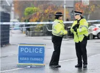  ??  ?? INVESTIGAT­ION Police at scene of the attack in Coupar Angus