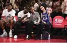  ?? Dow/NBAE/Getty Images ?? Sacramento Kings owner Vivek Ranadivé and rapper 50 Cent pose for a selfie with a fan during a Summer League game on Sunday in Las Vegas. Photograph: David