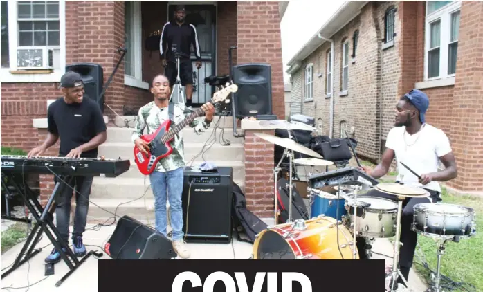  ??  ?? Jeremiah Collier and the REUP deliver jazz standards during a recent porch session. BRIAN RICH/SUN-TIMES