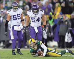  ?? NETWORK-WISCONSIN DAN POWERS/USA TODAY ?? Packers quarterbac­k Brett Hundley is stopped on third down in the third quarter against the Minnesota Vikings on Saturday night.