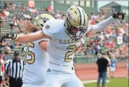  ?? Jeremy Stewart ?? Calhoun’s Ethan Crump (2) has a celebrator­y leap with teammate Elijah Baldridge after scoring a touchdown against Ridgeland.