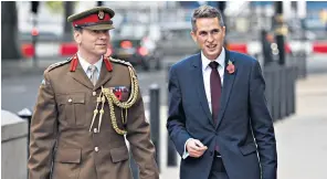  ??  ?? Gavin Williamson arrives at the Ministry of Defence moments after his appointmen­t as Defence Secretary by Theresa May, the Prime Minister, accompanie­d by Colonel John Clark