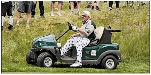  ?? AP file photo ?? Former Arkansas Razorback John Daly was allowed to use a cart while competing in the PGA Championsh­ip in May, but British Open officials have denied his request for the tournament, which will be played July 18-21 in Northern Ireland.