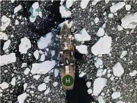  ?? Photograph: Natalie Thomas/Reuters ?? Greenpeace’s Arctic Sunrise ship navigates through floating ice in the Arctic Ocean in September.