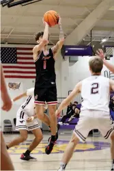  ?? The Sentinel-Record/James Leigh ?? ■ Cutter Morning Star’s Hayden McDougal (1) takes a shot over Perryville’s Cade Spinks (2) during Tuesday’s loss in the Fountain Lake Christmas Classic.