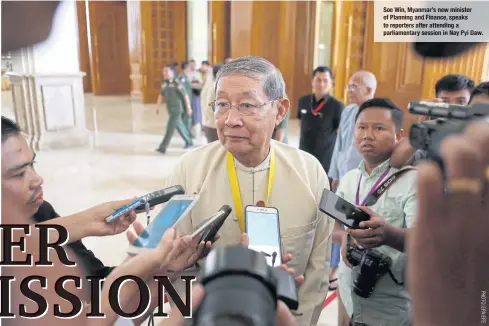  ??  ?? Soe Win, Myanmar’s new minister of Planning and Finance, speaks to reporters after attending a parliament­ary session in Nay Pyi Daw.