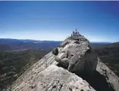  ?? PEGGY PEATTIE U-T FILE ?? Families climb to the top of Stonewall Peak at Cuyamaca Rancho State Park.