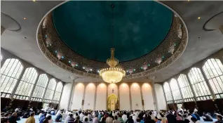  ??  ?? Muslim men attend prayers on Eid Al-Fitr at the Regent’s Park Mosque in London. (Files/AFP)