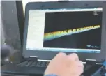  ??  ?? Benjamin Phillips, a dam safety inspector with the Tennessee Valley Authority, uses TVA’s new 3D scanning sonar technology to perform a dam inspection at Chickamaug­a Dam on Thursday.