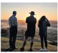  ??  ?? Walkers enjoy a bright start to autumn on Glastonbur­y Tor on the day of the equinox