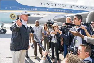  ?? DOUG MILLS / THE NEW YORK TIMES ?? President Donald Trump speaks to reporters about DACA as he arrives to survey recovery efforts after Hurricane Irma in Fort Myers, Fla., on Thursday. Trump said he was “fairly close” to an agreement that could protect the so-called “Dreamers” while...