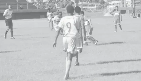  ??  ?? Action in the Sir Leon Lessons and DC Caesar Fox game of the Digicel Schools Football Championsh­ip quarterfin­al round at the National Track and Field Centre, Leonora yesterday.