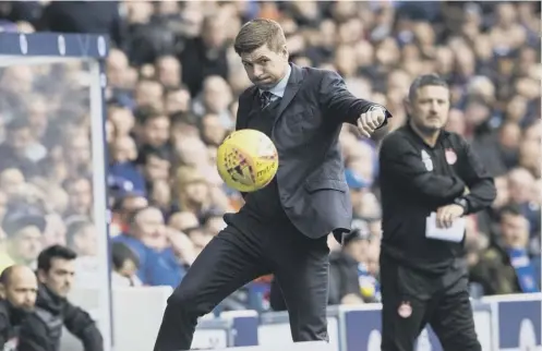  ?? PICTURE: SNS ?? 0 Rangers boss Steven Gerrard proves he has lost none of his skills as he juggles with the ball on the touchline yesterday.
