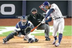  ?? Seth Wenig/Associated Press ?? Houston Astros' George Springer (4)
connects for a three-run home run against the New York Yankees during
Game 4 of the American League Championsh­ip Series on Thursday in
New York.