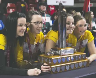  ?? JONATHAN HAYWARD/THE CANADIAN PRESS ?? Team Manitoba skip Kerri Einarson, from left, third Val Sweeting, second Shannon Birchard and lead Briane Meilleur celebrate their Scotties Tournament of Hearts victory.