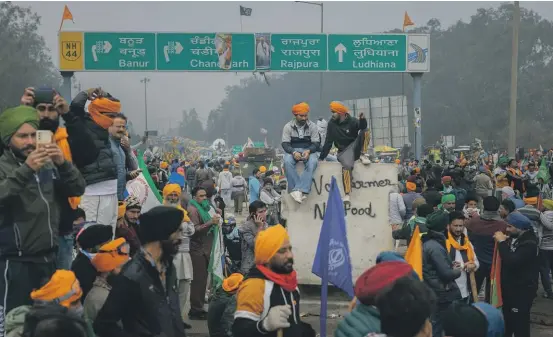  ?? ELKE SCHOLIERS/GETTY IMAGES ?? A protest march by Indian farmers heads towards Delhi, as the farmers demand guaranteed crop prices. India’s protection­ist agricultur­e policies are expected to require some delicate negotiatio­ns at this week’s WTO conference, writes Geoffrey Miller.