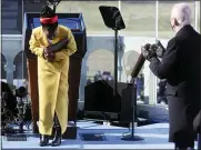  ?? JONATHAN ERNST— POOL PHOTO VIA AP ?? Poet Amanda Gorman takes a bow as President Joe Biden applauds after she recited her inaugural poem during the presidenti­al inaugurati­on at the U.S. Capitol on Wednesday,