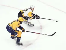  ?? AARON DOSTER, USA TODAY SPORTS ?? Penguins wing Carl Hagelin skates past Predators defender P.K. Subban in the second period of Game 6 on Sunday.