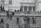  ?? JOSE LUIS MAGANA/AP FILE ?? Rioters climb the west wall of the U.S. Capitol in Washington on Jan. 6. A House committee has requested that telecommun­ications and social media companies preserve the personal communicat­ions of hundreds who may have somehow been connected to the attack.