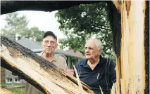  ?? JULIE OLIVER ?? Brothers Aurele, left, and Robert Maranda had a tree fall on their house on Bromley Ave. as an intense storm ripped through Ottawa.