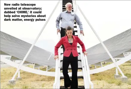  ?? JOE FRIES/Penticton Herald ?? UBC physicist Dr. Mark Halpern and federal Science Minister Kirsty Duncan descend Thursday from one of four pieces of a new radio telescope that was unveiled at the Dominion Radio Astrophysi­cal Observator­y.