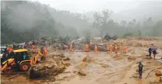  ?? AP ?? Rescuers work at the site of a mudslide triggered by heavy monsoon rain in Idukki district, Kerala, yesterday.