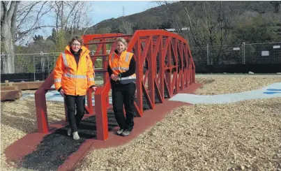 ?? PHOTO: TRACIE BARRETT ?? Local factor . . . Central Otago District Council parks officer projects Marie Gordon (left) and project manager Adele Eyers say the red bridge structure was popular with the Clyde community during public consultati­on.