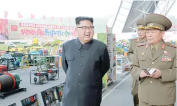  ?? — Reuters ?? North Korean leader Kim Jong Un at an expo organised by the Ministry of the People’s Armed Forces on Saturday.