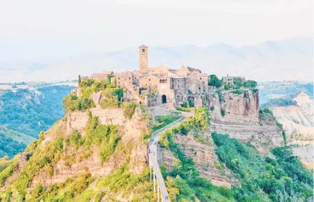  ?? DOMINIC ARIZONA BONUCCELLI/RICK STEVES’ EUROPE ?? Civita is perched on a pinnacle.