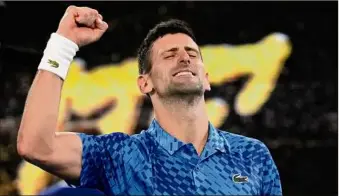  ?? Aaron Favila / Associated Press ?? Novak Djokovic of Serbia celebrates after defeating Tommy Paul of the U.S. in their semifinal at the Australian Open on Friday. He won in straight sets Friday.