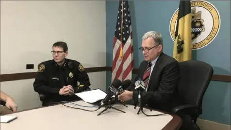  ?? Rich Lord/Post-Gazette ?? Pittsburgh Public Safety Director Wendell Hissrich, right, and police Deputy Chief Thomas Stangrecki talk Friday at the CityCounty Building, Downtown, about preparatio­ns for New Year’s Eve.