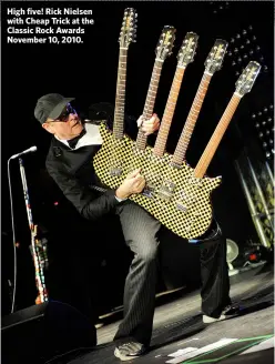  ??  ?? High five! Rick Nielsen with Cheap Trick at the Classic Rock Awards November 10, 2010.