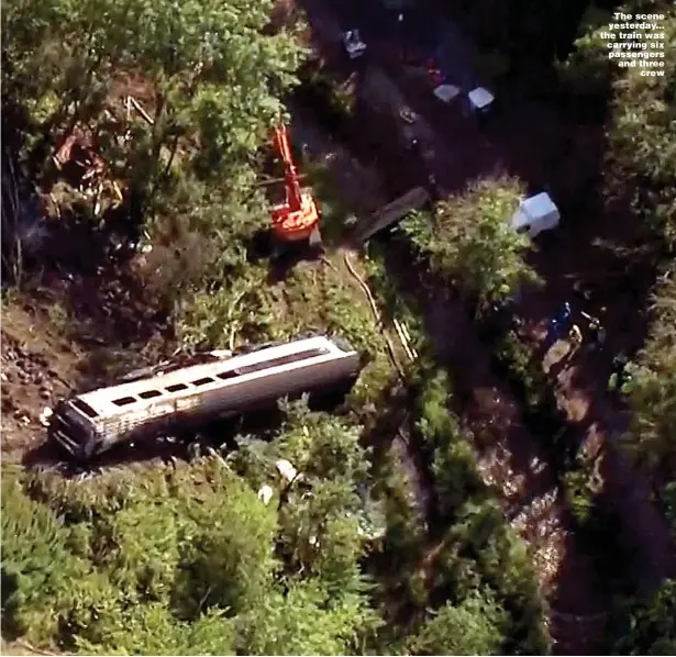  ??  ?? The scene yesterday... the train was carrying six passengers and three crew