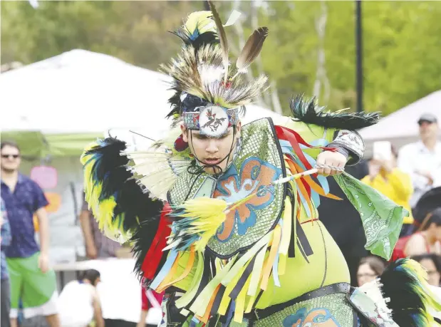  ?? John Lappa / Postmedia News ?? Montana Mcgregor dances at the National Indigenous Peoples Day celebratio­ns in Sudbury on Friday.