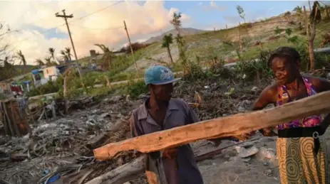  ?? HECTOR RETAMAL/AFP/GETTY IMAGES ?? As residents rebuild after Hurricane Matthew devastated southweste­rn Haiti, there may be no way to restore a decades-long effort to reforest the area.