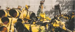  ?? ANDREW SPEAR/NEW YORK TIMES ?? Broken streetligh­ts used for spare parts are piled in a lot Monday in Lorain, Ohio. Some state government­s have a budget surplus, and cities that have been suffering financiall­y want a cut of the money.