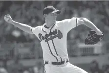 ?? AP PHOTO/JOHN AMIS ?? Atlanta Braves pitcher Brandon McCarthy pitches during the first inning of Saturday’s 14-inning game against the Washington Nationals in Atlanta.