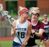  ?? BILL RUDICK — DIGITAL FIRST MEDIA ?? West Chester Rustin’s Skyler Demis, tries to evade the checking of Abington’s Samantha McGee during Thursday’s District 1 Class 3A 7th-place game.