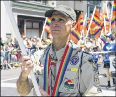  ?? BRIAN GORMAN / AP ?? Greg Bourke from Louisville, Ky., marching in the gay pride parade in New York, went public with how the Archdioces­e of Louisville refused to reinstate him as a leader of a Catholic-sponsored Scout troop.