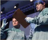  ??  ?? A session in New York on safe practices for handling Ebola patients included a demonstrat­ion on the CDC’s new protocols for protective equipment.