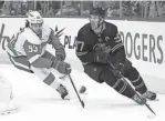  ?? TODAY SPORTS
PERRY NELSON/USA ?? The Oilers’ Connor McDavid (97) protects the puck from Wings defensemen Moritz Seider in Edmonton on Feb. 15, 2023.