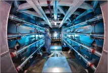  ?? LAWRENCE LIVERMORE NATIONAL LABORATORY VIA THE NEW YORK TIMES ?? A technician works at the National Ignition Facility of the Lawrence Livermore National Laboratory in Livermore, which the Department of Energy says has made a “major scientific breakthrou­gh.”