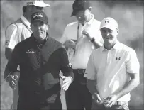  ??  ?? Phil Mickelson, left, gestures as he talks to Jordan Spieth during Tuesday’s practice round ahead of the British Open at Royal Birkdale, Southport, England.