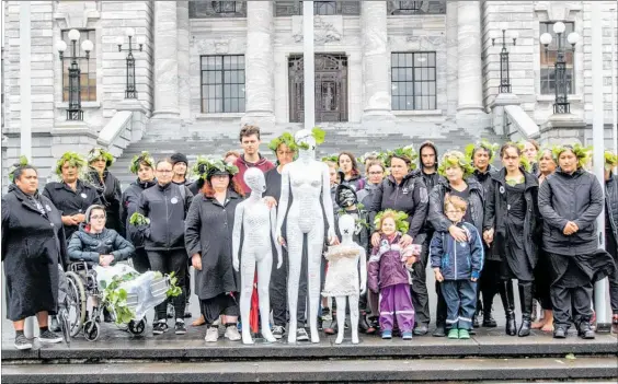  ?? LVN301118n­sns2 PHOTO / OLIVER PARRANT ?? A group of from Horowhenua met other survivors on the steps of Parliament to deliver ‘Untitled Woman and Children’ by Sarah-Jayne Shine and deliver a petition to uphold the United Nations Recommenda­tions for a Royal Commission of Inquiry into the Family Court.