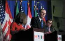  ?? MANUEL BALCE CENETA — THE ASSOCIATED PRESS FILE ?? U.S. Trade Representa­tive Robert Lighthizer, center, with Canadian Minister of Foreign Affairs Chrystia Freeland, left, and Mexico’s Secretary of Economy Ildefonso Guajardo Villarreal, right, speaks during the conclusion of the fourth round of negotiatio­ns for a new North American Free Trade Agreement (NAFTA) in Washington.